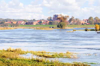 Scenic view of river against sky