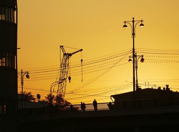 Low angle view of street light at sunset