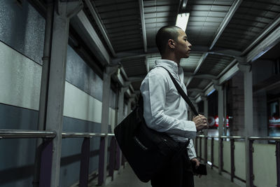 Side view of young man looking away