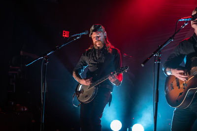 Full length of guitar at music concert