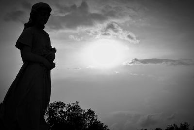 Low angle view of statue against sky