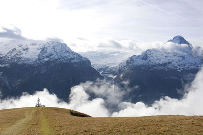 Scenic view of snowcapped mountains against sky