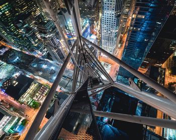 High angle view of city lit up at night