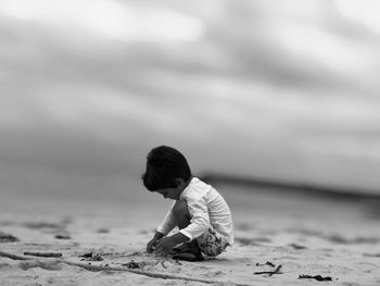 Side view of boy on shore