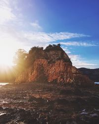 Rock formations on landscape against sky