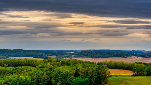 Scenic view of field against sky during sunset