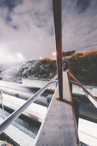 Railroad tracks against sky during winter