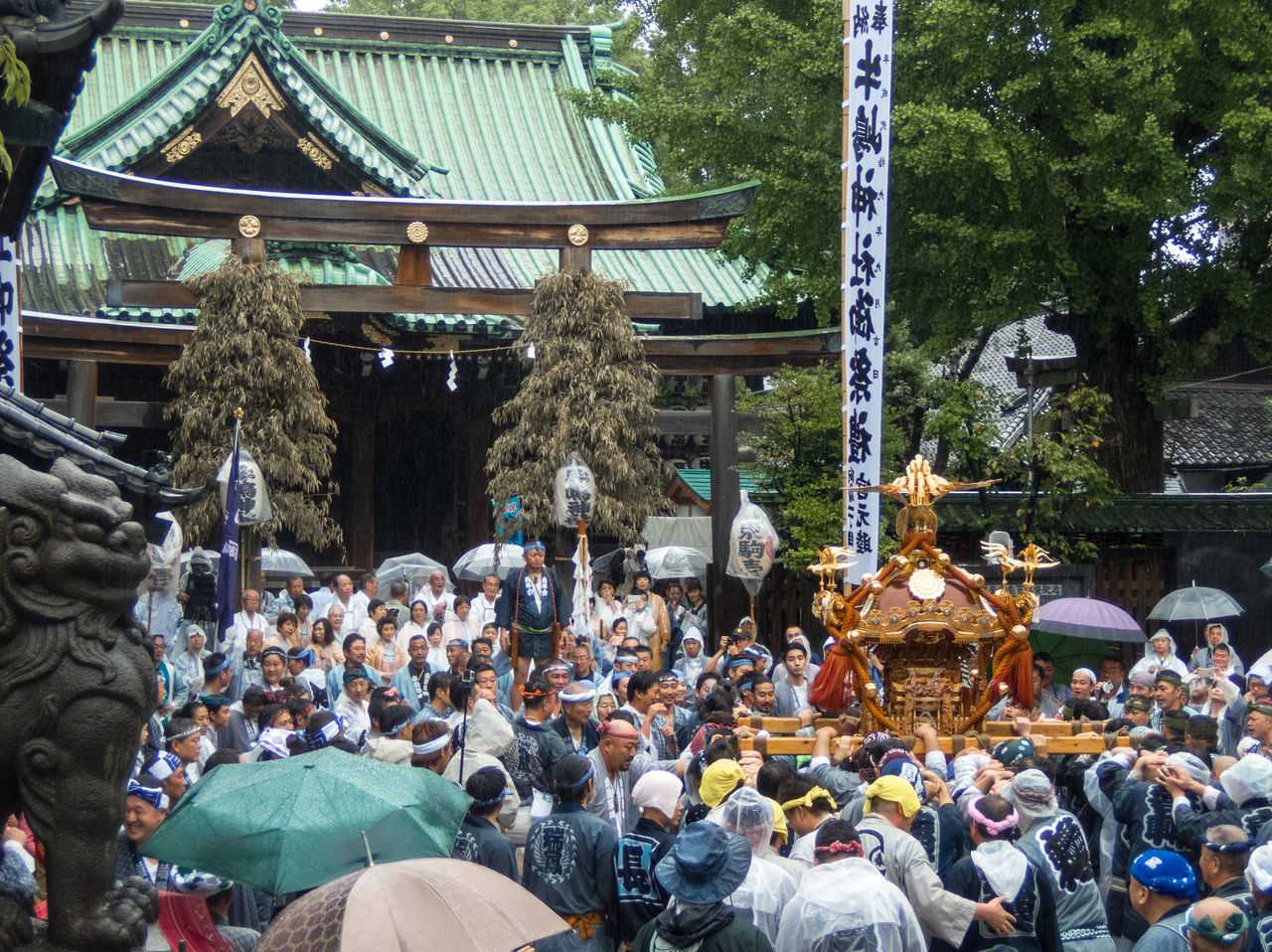 PEOPLE AT TEMPLE AGAINST TREES