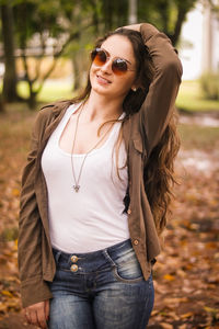 Portrait of smiling beautiful woman wearing sunglasses
