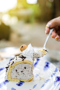 Midsection of person holding ice cream