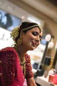 Portrait of a smiling young woman looking away