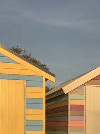 Low angle view of multi colored buildings against sky