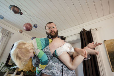 Father playing with daughter