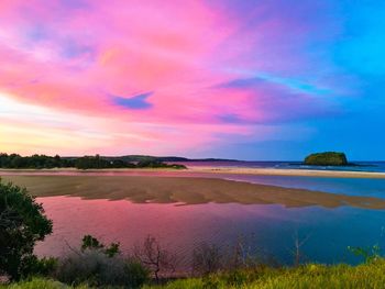 Scenic view of sea against sky at sunset