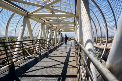 People walking on footbridge