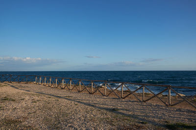 Scenic view of sea against blue sky