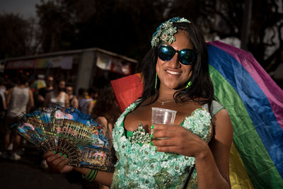 Young woman wearing sunglasses mask outdoors