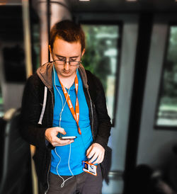 Young man using mobile phone