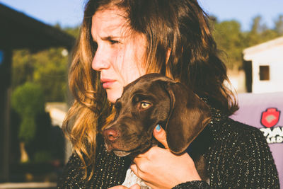 Portrait of woman with dog