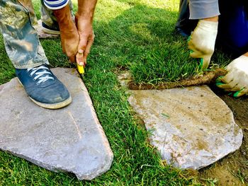 Low section of man working on field