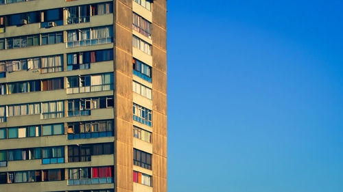 Low angle view of building against clear blue sky