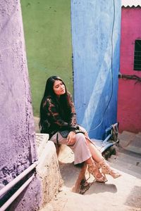 Young woman sitting outdoors