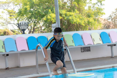 Full length of boy in swimming pool