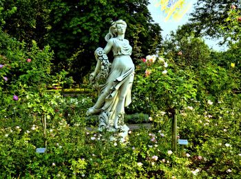 Statue of woman in park