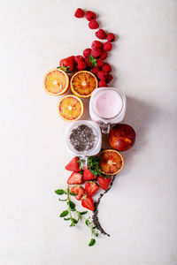 High angle view of fruits against white background