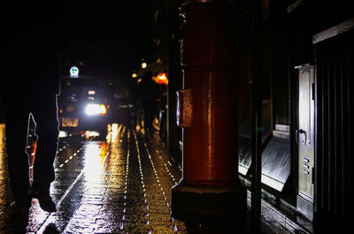 Illuminated car in city at night