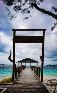 Pier over sea against sky