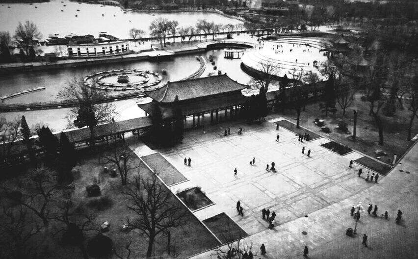 HIGH ANGLE VIEW OF PEOPLE WALKING ON ROAD