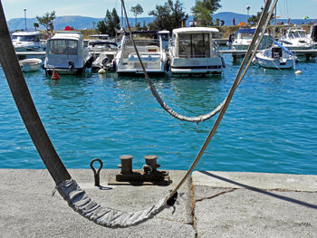 Boats moored at harbor