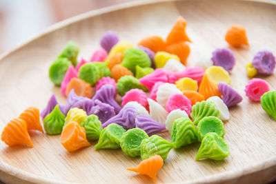 Close-up of multi colored candies on table