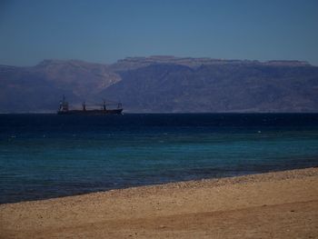 Scenic view of sea against blue sky