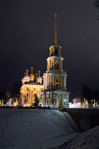 Illuminated cathedral against sky at night