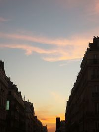 Low angle view of buildings against sky during sunset