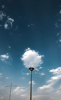 Low angle view of street light against sky