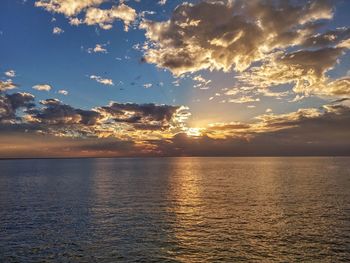 Scenic view of sea against sky at sunset