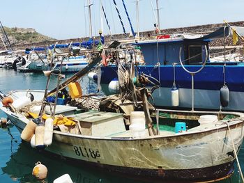 Fishing boats moored at harbor