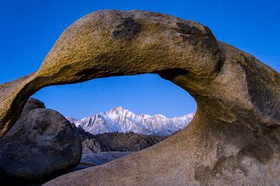 Scenic view of mountain against clear blue sky