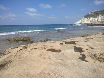 Scenic view of beach against sky