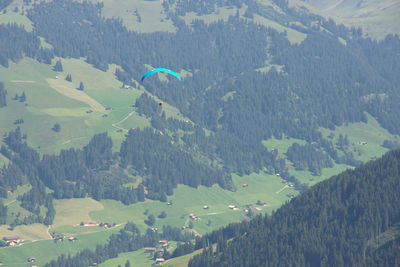 Aerial view of green landscape against sky