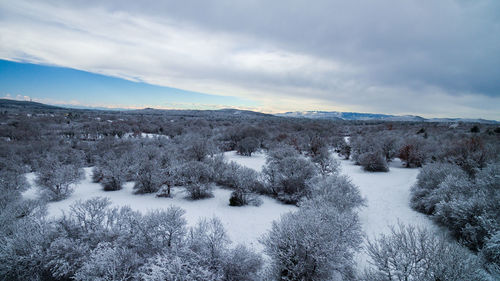 Scenic view of snowcapped landscape against sky