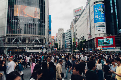 Group of people walking on city street