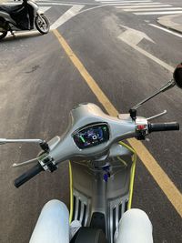 High angle view of person riding bicycle on road