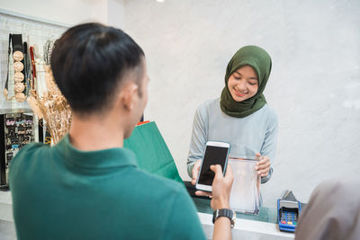 Young woman using mobile phone