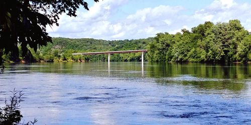 Bridge over lake against sky