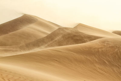 Scenic view of desert against sky