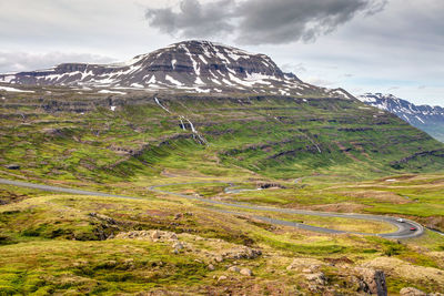 Scenic drive in the mountains down to the lovely town of seydisfjordur in iceland